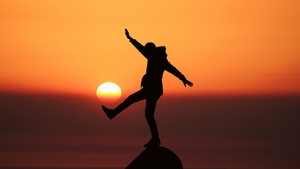 Silhouette, Person, Sunset, Orange sky, Dawn, Standing, Rock, 4K wallpaper