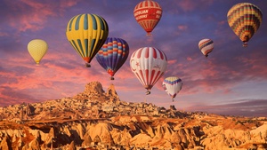 Hot air balloons, Golden hour, Rock formations, Town, Tourist attraction, Turkey, 4K wallpaper