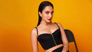 Kiara Advani, Black dress, Orange background, Indian actress, 4K wallpaper