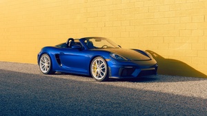 Porsche 718 Spyder, Yellow background, Brick wall, 4K wallpaper